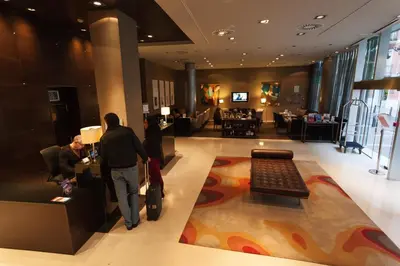 a group of people standing in a hotel lobby at Hotel Conqueridor in Valencia