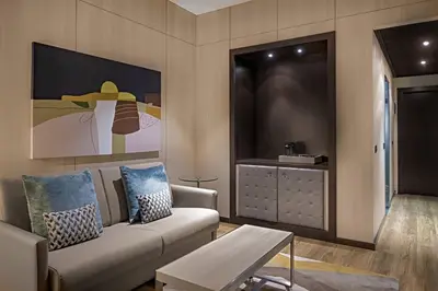 a living room with a couch and a table at AC Hotel Valencia by Marriott in Valencia