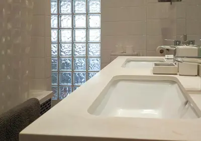 a bathroom with two sinks and a bath tub at Enjoy Apartment 4 pax at Ruzafa with sunny terrace in Valencia