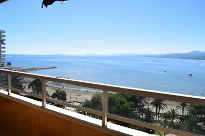 a view of the beach from the balcony of a condo at Apartamento Florazar 2, 10ºC Cullera in Faro de Cullera