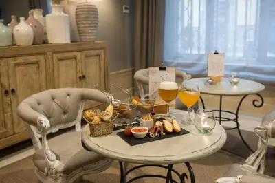 a table with a tray of food and two glasses of wine at Vincci Lys in Valencia
