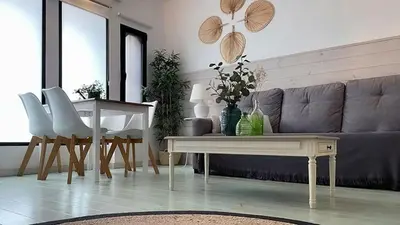 a living room with a couch and a table at New Cozy Beach apartment, WiFi in Valencia