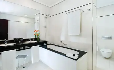 a white bathroom with a sink and a toilet at Hotel Valencia Center in Valencia