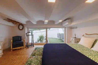 a bedroom with a large bed and a large window at Artistic Loft, Full Of Light - City Center Ruzafa in Valencia