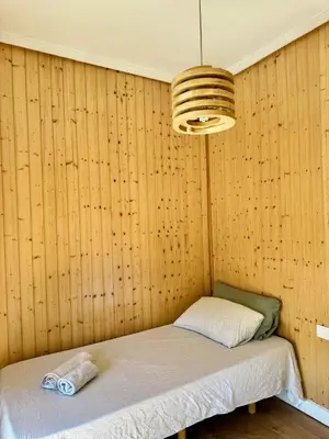 a room with a bed in a wooden wall at Vlc Center 4 Room Apartment in Valencia