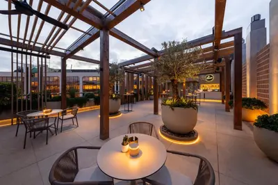 a patio with tables and chairs on a building at SH Valencia Palace in Valencia