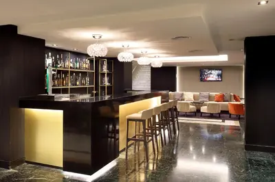 a bar with stools in a room at Exe Rey Don Jaime in Valencia