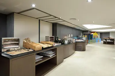 a restaurant with a counter with food on it at Exe Rey Don Jaime in Valencia
