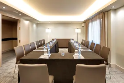 a large conference room with a long table and chairs at Exe Rey Don Jaime in Valencia