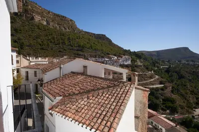 a view from the roof of a building with a mountain at El mas allà in Chulilla