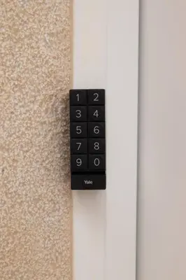 a black remote control on the side of a door at Viveros by Concept Flats in Valencia