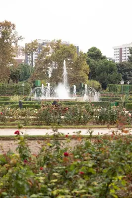 a fountain in the middle of a park with flowers at Viveros by Concept Flats in Valencia