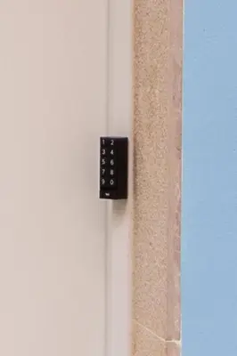 a close up of a door with a remote control on it at Viveros by Concept Flats in Valencia