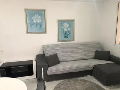 a living room with a couch and a tv at Florazar 3 in Cullera