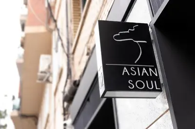 a sign for a asian soul on the side of a building at Art Lofts Gardens in Valencia