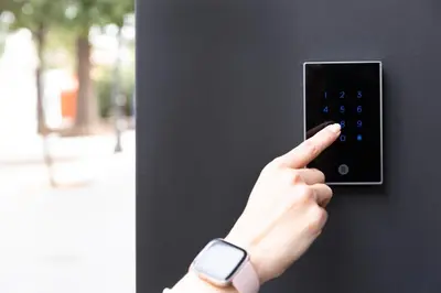a person holding a lightswitch with a watch on their hand at Art Lofts Gardens in Valencia