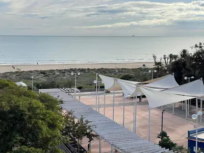 a view of a beach with white tents and the ocean at AGH Canet in Canet de Berenguer