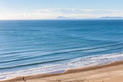 an aerial view of the ocean with a sandy beach at Florazar Apartment Cullera Beachfront in Cullera