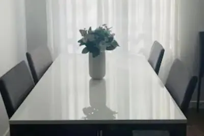 a table with a vase with a plant on it at amazing cozy apartment super central in Valencia