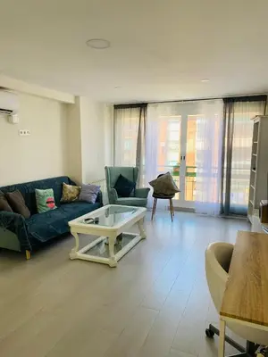 a living room with a couch and a coffee table at Apartamento Cuidad Ciencias in Valencia