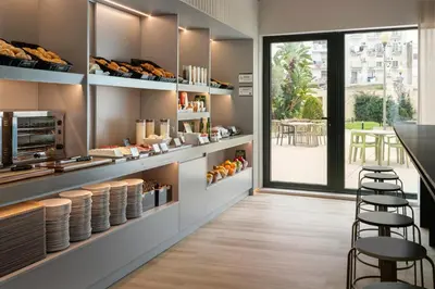 a bakery with a view of a patio at B&B HOTEL Valencia Arena in Valencia
