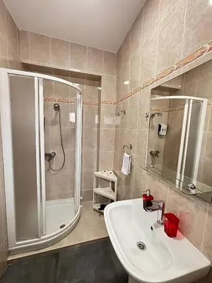 a bathroom with a shower and a sink and a shower at Apartamento Sofía II a 500m de la playa in Puerto de Sagunto