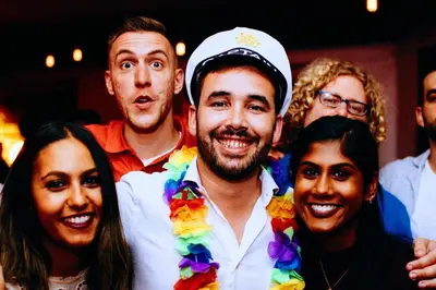 a group of people in costumes posing for a picture at Red Nest Hostel in Valencia