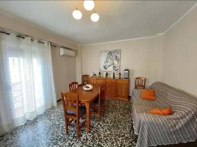 a bedroom with a table and a bed and a table and chairs at Las Peñetas in Bolbaite
