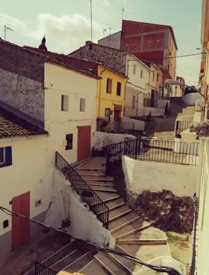 a group of stairs leading up to some buildings at Las Peñetas in Bolbaite