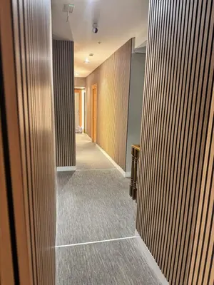 a hallway with wood panels on the walls of a building at Hotel Mediterraneo Valencia in Valencia