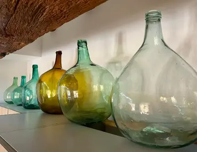 a group of glass vases sitting on a shelf at Ca La Abuela in Requena