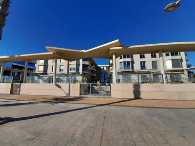 a large building with a large roof at FiveStepsToSea - Beach Apartment Valencia in Valencia
