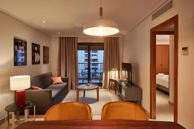 a living room with a couch and a table at Sea view modern flat in Alboraya