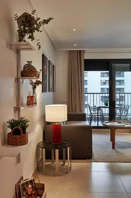a living room with a couch and a table at Sea view modern flat in Alboraya