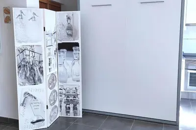 a refrigerator with drawings and pictures on it at Precioso apartamento en el Faro de Cullera in Cullera