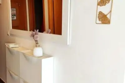 a bathroom with a white sink and a mirror at Precioso apartamento en el Faro de Cullera in Cullera