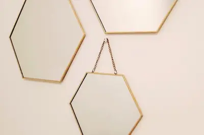 a group of mirrors hanging on a wall at Precioso apartamento en el Faro de Cullera in Cullera