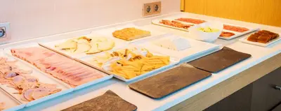 a table with many different types of food on it at Ilunion Aqua 3 in Valencia