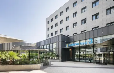 a rendering of the entrance to a building at Ilunion Aqua 3 in Valencia