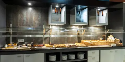 a buffet line with many different types of food at Ilunion Aqua 4 in Valencia