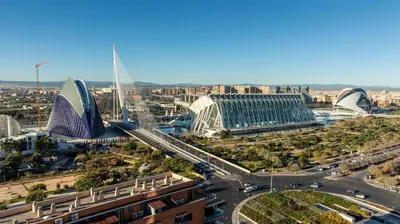 an aerial view of a city with buildings and a freeway at Ilunion Aqua 4 in Valencia