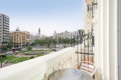 a balcony with a table and a view of a city at Venecia Plaza Centro in Valencia