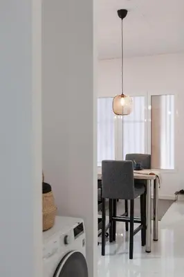 a kitchen and dining room with a table and a chair at Digital Nomad Retreat 2 -Great Location Near Metro in Valencia