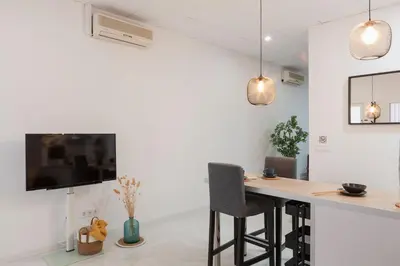 a kitchen with a desk and a tv on a wall at Digital Nomad Retreat 2 -Great Location Near Metro in Valencia