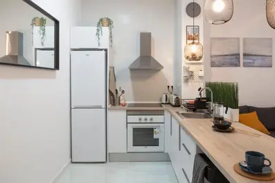 a kitchen with a white refrigerator and a counter at Digital Nomad Retreat 2 -Great Location Near Metro in Valencia