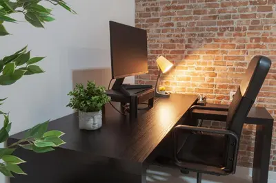 a desk with a computer monitor and a lamp on it at Digital Nomad Retreat 2 -Great Location Near Metro in Valencia