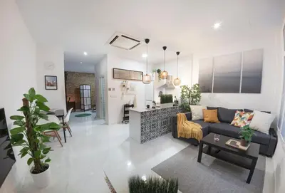 a living room with a couch and a table at Artistic Digital Retreat-Great Location Near Metro in Valencia