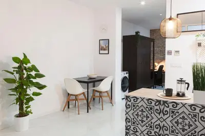 a kitchen and dining room with a table and chairs at Artistic Digital Retreat-Great Location Near Metro in Valencia