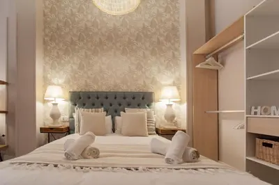 a bedroom with a large white bed with two lamps at MD Patacona Beach Mid-term in Valencia