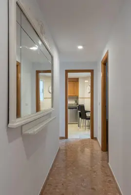 a hallway with a mirror on the wall at Magnifico apartamento en Burriana in Burriana